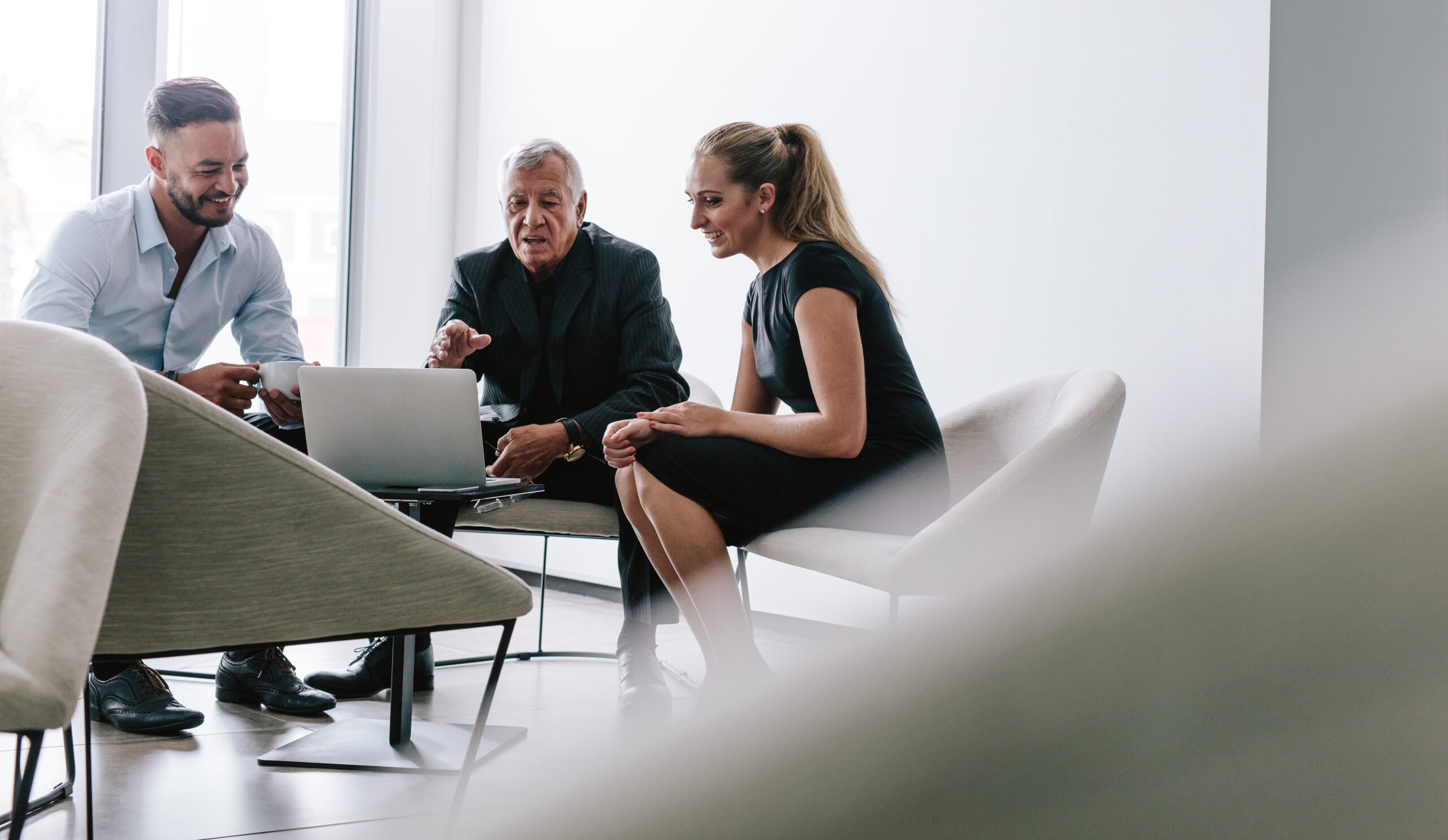Group,Of,Business,People,Meeting,In,Office,Foyer.,Business,Team